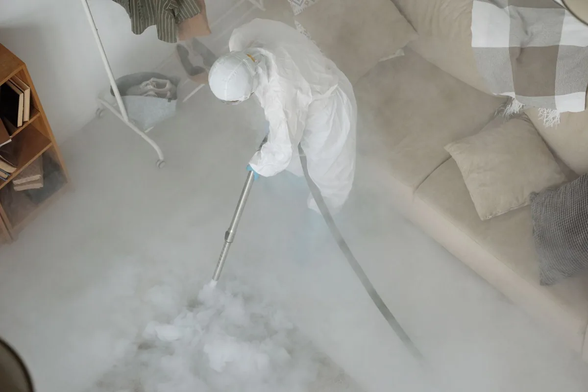 Biohazard cleanup technician in protective equipment, Tullytown, PA